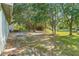 The large backyard is partially shaded by mature trees at 2110 3Rd Ave, Deland, FL 32724