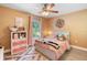 Bedroom with ceiling fan and a large window at 2110 3Rd Ave, Deland, FL 32724