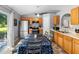 Eat-in kitchen with stainless steel appliances and a sliding glass door to the patio at 2110 3Rd Ave, Deland, FL 32724