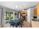 Eat-in kitchen with stainless steel appliances and a sliding glass door to the patio at 2110 3Rd Ave, Deland, FL 32724
