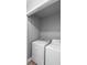 The laundry room includes a white washer and dryer at 2110 3Rd Ave, Deland, FL 32724