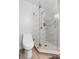 Corner shower with glass door and wave patterned tile walls at 2110 3Rd Ave, Deland, FL 32724