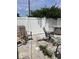 Backyard patio area, enclosed with a white fence, needs to be cleared of debris and unkept landscape maintenance at 2210 Se 1St St, Orange City, FL 32763