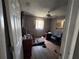 Bedroom featuring hardwood floors, neutral walls, ceiling fan, and natural light through windows at 2210 Se 1St St, Orange City, FL 32763