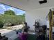 Outdoor patio with partial covering featuring ample space and potential for entertaining and storage at 2210 Se 1St St, Orange City, FL 32763