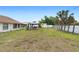 Spacious backyard featuring a large gazebo and mature palm trees at 2287 Belen Dr, Deltona, FL 32738