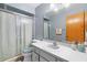 This bathroom features a vanity with a sink and a walk-in shower at 2287 Belen Dr, Deltona, FL 32738