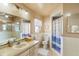 Traditional bathroom features a vanity, toilet, shower, and tub at 2287 Belen Dr, Deltona, FL 32738