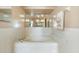 Traditional bathroom features a whirlpool tub and large mirror at 2287 Belen Dr, Deltona, FL 32738