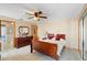 Cozy bedroom featuring tile floor, dark wood furniture, and a soft decorative touches at 2287 Belen Dr, Deltona, FL 32738