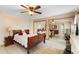 Bedroom with mirrored closet doors, ceiling fan, and traditional-style furnishings at 2287 Belen Dr, Deltona, FL 32738