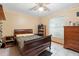 Traditional bedroom features a bed, dresser, and ceiling fan at 2287 Belen Dr, Deltona, FL 32738