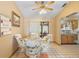 Bright breakfast nook with sliding door, ceiling fan, and cozy seating area at 2287 Belen Dr, Deltona, FL 32738
