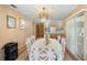View of open dining room with chandelier, traditional furniture, and access to kitchen at 2287 Belen Dr, Deltona, FL 32738