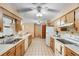 Functional kitchen with ample cabinet space, tile flooring, and essential appliances at 2287 Belen Dr, Deltona, FL 32738