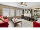 Cozy living room with tile floors, ceiling fan and large windows at 2287 Belen Dr, Deltona, FL 32738