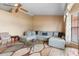 Inviting living room featuring a large sectional, natural light, and neutral color scheme at 2287 Belen Dr, Deltona, FL 32738
