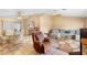 Cozy living room featuring tile floors, ceiling fans, and lots of natural light at 2287 Belen Dr, Deltona, FL 32738