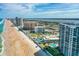 Stunning aerial view of beachfront condos with beautiful blue ocean, sandy beach, and sparkling pools at 2425 S Atlantic Ave # 1202A, Daytona Beach Shores, FL 32118
