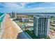 Expansive aerial shot of condos along the oceanfront, showing beach access and surrounding cityscape at 2425 S Atlantic Ave # 1202A, Daytona Beach Shores, FL 32118