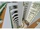 Dramatic atrium view showing multiple floors, interior design, and elevator shafts at 2425 S Atlantic Ave # 1202A, Daytona Beach Shores, FL 32118