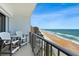 Balcony featuring seating overlooking the pool, beach, and ocean views at 2425 S Atlantic Ave # 1202A, Daytona Beach Shores, FL 32118