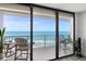 Balcony with ocean views offers outdoor seating with chairs and bar-style seating at 2425 S Atlantic Ave # 1202A, Daytona Beach Shores, FL 32118