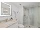 Modern bathroom featuring an LED mirror and glass shower with decorative tile at 2425 S Atlantic Ave # 1202A, Daytona Beach Shores, FL 32118