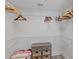 Walk-in closet with metal shelving and chest of drawers at 2425 S Atlantic Ave # 1202A, Daytona Beach Shores, FL 32118