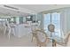 Bright dining area with a bar, glass table, and ocean views, creating a perfect spot for meals and entertaining at 2425 S Atlantic Ave # 1202A, Daytona Beach Shores, FL 32118