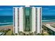 Striking direct exterior view of the condo building showing balcony views at 2425 S Atlantic Ave # 1202A, Daytona Beach Shores, FL 32118