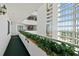 Bright hallway with planters overlooking a view of the city at 2425 S Atlantic Ave # 1202A, Daytona Beach Shores, FL 32118