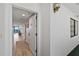 Condo hallway with wood floors leading to a living area with ocean views at 2425 S Atlantic Ave # 1202A, Daytona Beach Shores, FL 32118