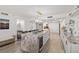 Modern kitchen with a large island, granite countertops, and stainless steel appliances at 2425 S Atlantic Ave # 1202A, Daytona Beach Shores, FL 32118