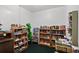 Inviting library area featuring well-stocked bookshelves, a comfortable atmosphere, and room for relaxation and reading at 2425 S Atlantic Ave # 1202A, Daytona Beach Shores, FL 32118