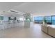 Open living area featuring a bar, dining set, comfortable sofa, and stunning ocean views for relaxation and enjoyment at 2425 S Atlantic Ave # 1202A, Daytona Beach Shores, FL 32118