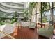 Cozy lobby space with a view, featuring tiled flooring, comfortable chairs, and lush plants at 2425 S Atlantic Ave # 1202A, Daytona Beach Shores, FL 32118