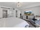 Bright main bedroom with modern decor, closet, and bathroom views at 2425 S Atlantic Ave # 1202A, Daytona Beach Shores, FL 32118
