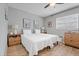 Inviting bedroom featuring hardwood floors, neutral walls, and comfortable twin beds at 2500 Lee Rd # 134, Winter Park, FL 32789