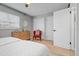 Comfortable bedroom offering twin beds, wood-look floors, and natural light from the window at 2500 Lee Rd # 134, Winter Park, FL 32789