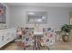 Bright dining area featuring a white table, colorful chairs, and modern decor at 2500 Lee Rd # 134, Winter Park, FL 32789