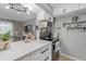 Modern kitchen featuring white cabinets, stainless steel appliances, and an open layout at 2500 Lee Rd # 134, Winter Park, FL 32789