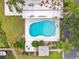 Aerial view of a private pool with a surrounding patio, landscaping, and lush greenery at 2500 Lee Rd # 134, Winter Park, FL 32789