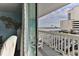 Enjoy ocean views from this balcony featuring white railings and comfortable seating at 2800 N Atlantic Ave # 206, Daytona Beach, FL 32118