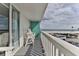 Relax on this balcony with white railings and seating, offering stunning ocean views at 2800 N Atlantic Ave # 206, Daytona Beach, FL 32118