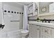 Neat bathroom with white tiles, vanity, and shower-tub combination at 2800 N Atlantic Ave # 206, Daytona Beach, FL 32118