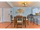 Cozy dining area featuring a modern light fixture and seating for four at 2800 N Atlantic Ave # 206, Daytona Beach, FL 32118