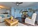 Relaxing living room featuring stylish décor, a ceiling fan, and lots of natural light at 2800 N Atlantic Ave # 206, Daytona Beach, FL 32118