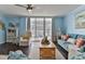 Cozy living room with neutral tones, balcony access, and comfortable seating at 2800 N Atlantic Ave # 206, Daytona Beach, FL 32118