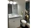 Cozy bathroom with a granite-topped vanity, sleek sink, and modern fixtures at 2841 Beal St, Deltona, FL 32738